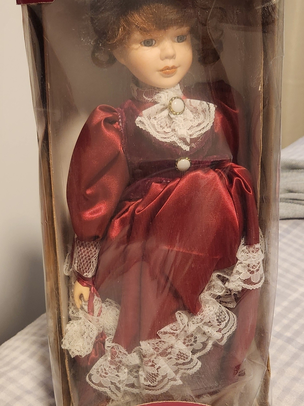 Porcelain Decorative Doll in Burgundy Dress